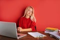 Portrait of young caucasian blonde female at work place Royalty Free Stock Photo