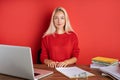 Portrait of young caucasian blonde female at work place Royalty Free Stock Photo