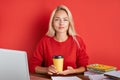 Portrait of young caucasian blonde female at work place Royalty Free Stock Photo