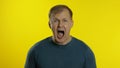 Portrait of young caucasian man posing in green t-shirt. Amazed handsome guy shocked, surprised Royalty Free Stock Photo