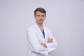 Portrait of young caucasian medical doctor in white medical gown Royalty Free Stock Photo