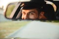 Portrait of young caucasian taxi driver man wearing uniform and Royalty Free Stock Photo