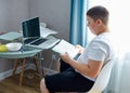 Portrait of young caucasian teen boy studying at home Royalty Free Stock Photo