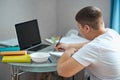 Portrait of young caucasian teen boy studying at home Royalty Free Stock Photo