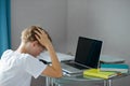 Portrait of young caucasian teen boy studying at home Royalty Free Stock Photo