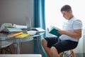 Portrait of young caucasian teen boy studying at home Royalty Free Stock Photo