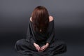 Portrait of a young caucasian woman praying. Prayer girl dressed in Vestments of a nun on gray studio background Royalty Free Stock Photo