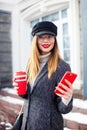 Portrait of young charming woman wearing fashionable glasses, business lady in elegant jacket , cute student in stylish cap . She