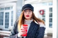 Portrait of young charming woman wearing fashionable glasses, red lips, business lady in elegant jacket , cute student in stylish Royalty Free Stock Photo