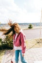 Portrait of young cheerful caucasian woman walking in the park and having fun, enjoying spring weather in sunny day Royalty Free Stock Photo