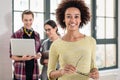 Portrait of young cheerful employee looking at camera in the off Royalty Free Stock Photo