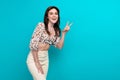 Portrait of young cheerful girlfriend in glamour summer top make v sign friendly symbol smiling  on aquamarine Royalty Free Stock Photo