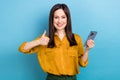 Portrait of young cheerful positive manager girl hold last iphone model fast speed wifi good interface thumb up isolated