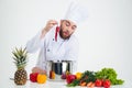 Portrait of a young chef cook preparing soup Royalty Free Stock Photo