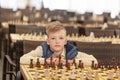 Portrait Young child on a chess tournament at a school Royalty Free Stock Photo