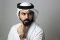 Portrait Of A Young Confident Arab Businessman Wearing UAE Emirati Tradational Dress Royalty Free Stock Photo