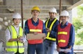 portrait young confident engineers teamwork and senior inspector engineer working outdoors at construction site Royalty Free Stock Photo