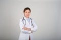 Portrait of young confident female doctor standing with her arms crossed Royalty Free Stock Photo