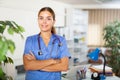 Portrait of a young female doctor standing in a resident's office Royalty Free Stock Photo