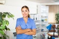 Portrait of a young female doctor standing in a resident's office Royalty Free Stock Photo