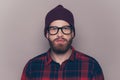 Portrait of young confident serious hipster man in glasses Royalty Free Stock Photo