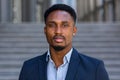 Portrait young confident successful African American businessman looking at camera close up face Serious black business man Royalty Free Stock Photo