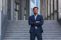 Portrait young confident successful African American businessman looking at camera Serious business man standing on urban Royalty Free Stock Photo