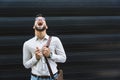 Portrait of young confident successful business man standing outside office building. Educated independent male team leader Royalty Free Stock Photo