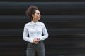 Portrait of young confident successful business woman standing outside office building. Educated independent female team leader Royalty Free Stock Photo