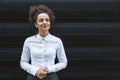 Portrait of young confident successful business woman standing outside office building. Educated independent female team leader Royalty Free Stock Photo