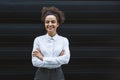 Portrait of young confident successful business woman standing outside office building. Educated independent female team leader Royalty Free Stock Photo