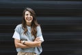 Portrait of young confident successful business woman standing outside office building. Educated independent female team leader Royalty Free Stock Photo