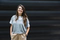 Portrait of young confident successful business woman standing outside office building. Educated independent female team leader Royalty Free Stock Photo