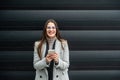 Portrait of young confident successful business woman standing outside office building. Educated independent female team leader Royalty Free Stock Photo