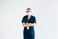 Portrait of young confident woman nurse hospital worker in medical protective mask isolated on white background Royalty Free Stock Photo