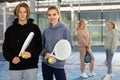 Portrait of a young woman with a boy-athlete standing with padel rackets and balls Royalty Free Stock Photo