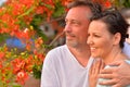 Portrait of a young couple against blooming tree