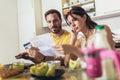 Young couple calculating bills at home Royalty Free Stock Photo