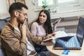 Portrait of young couple calculating budget at home Royalty Free Stock Photo