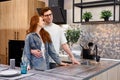 Portrait of young couple dreaming about new kitchen, home design Royalty Free Stock Photo