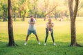 Portrait of Young couple exercise for health in the park at sunset. Concept sport and love. Warm tone Royalty Free Stock Photo