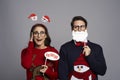 Portrait of couple with funny photo booth gadgets