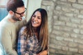 Portrait of a young couple hugging next to the window Royalty Free Stock Photo