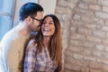 Portrait of a young couple hugging next to the window Royalty Free Stock Photo