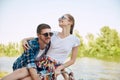 Portrait of young couple, laughing woman and her boyfriend going for a bike ride in park on summer day. Romantic Royalty Free Stock Photo