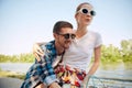 Portrait of young couple, laughing woman and her boyfriend going for a bike ride on a sunny summer day. Romantic Royalty Free Stock Photo