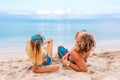 Portrait of young couple in love at beach and enjoying time being together. Young couple having fun on a sandy coast. Royalty Free Stock Photo