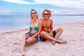 Portrait of young couple in love at beach and enjoying time being together. Young couple having fun on a sandy coast. Royalty Free Stock Photo