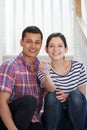 Portrait Of Young Couple Sitting On Stairs Holding Keys To New H Royalty Free Stock Photo