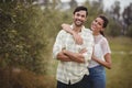 Portrait of young couple standing at olive farm Royalty Free Stock Photo